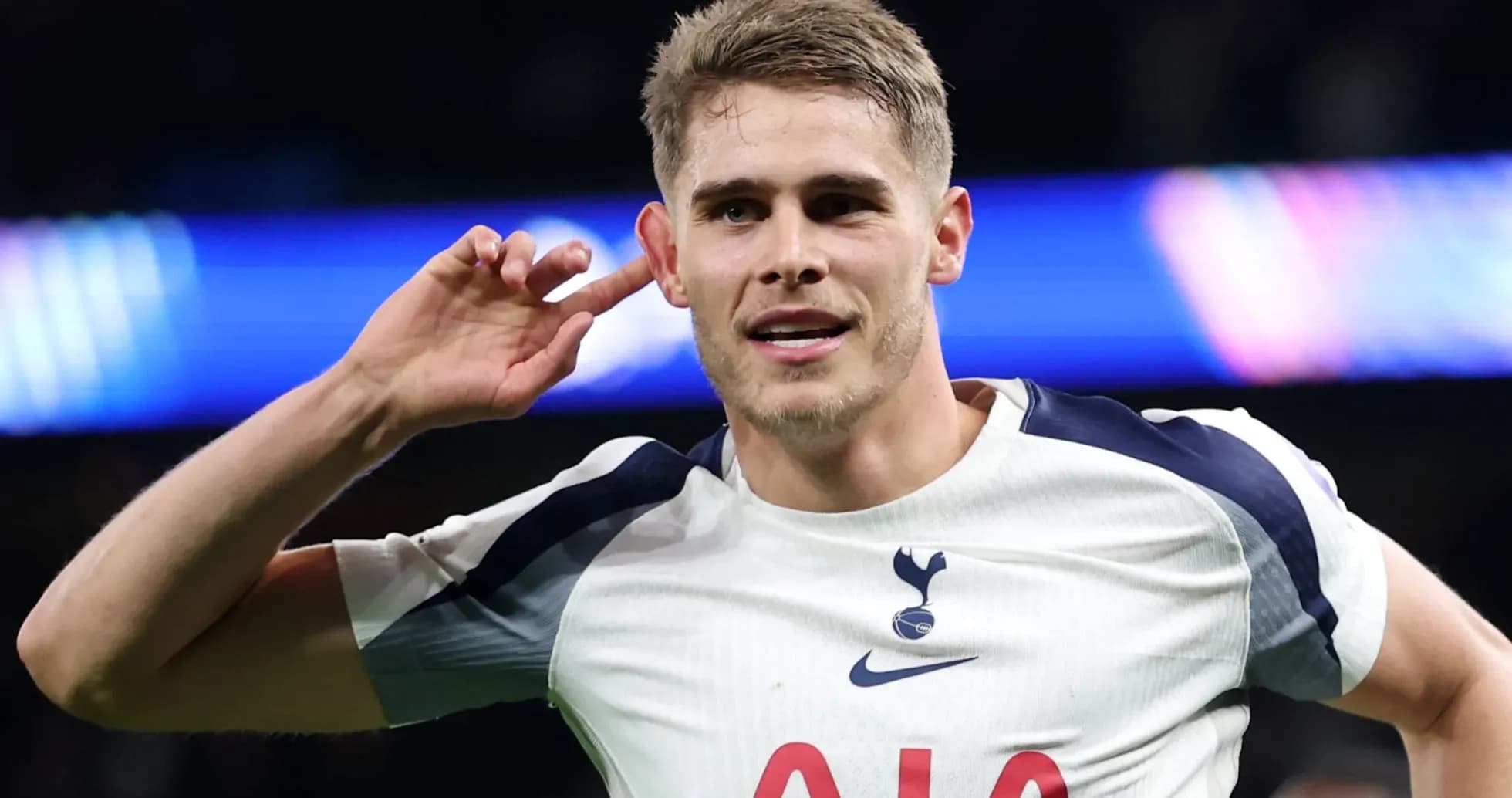 Player celebrating with hand to ear gesture