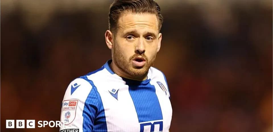 Player wearing blue and white jersey during match