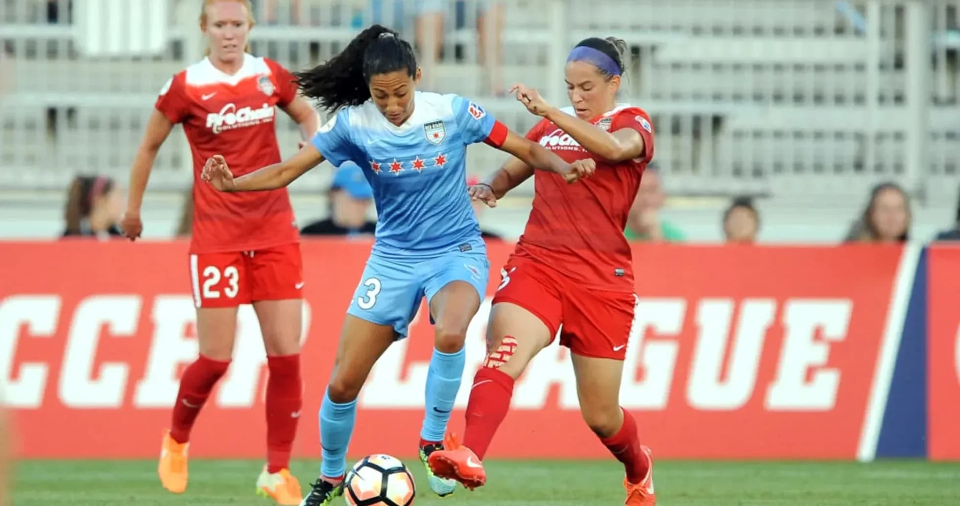 Chicago Red Stars player battling Washington Spirit opponent