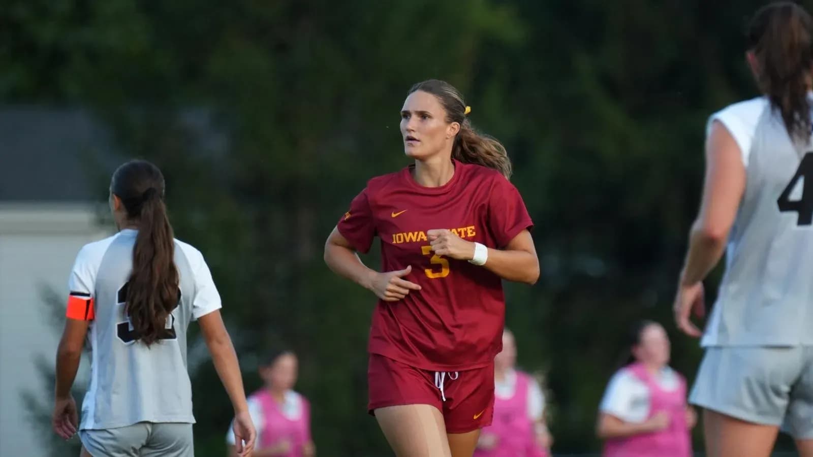 Iowa State player running on the soccer field