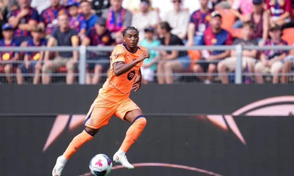 Player in orange kit running on the pitch