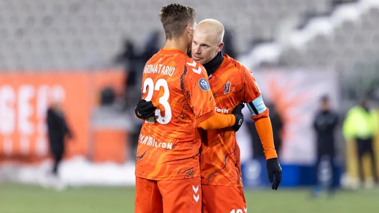 Two players celebrating on the field