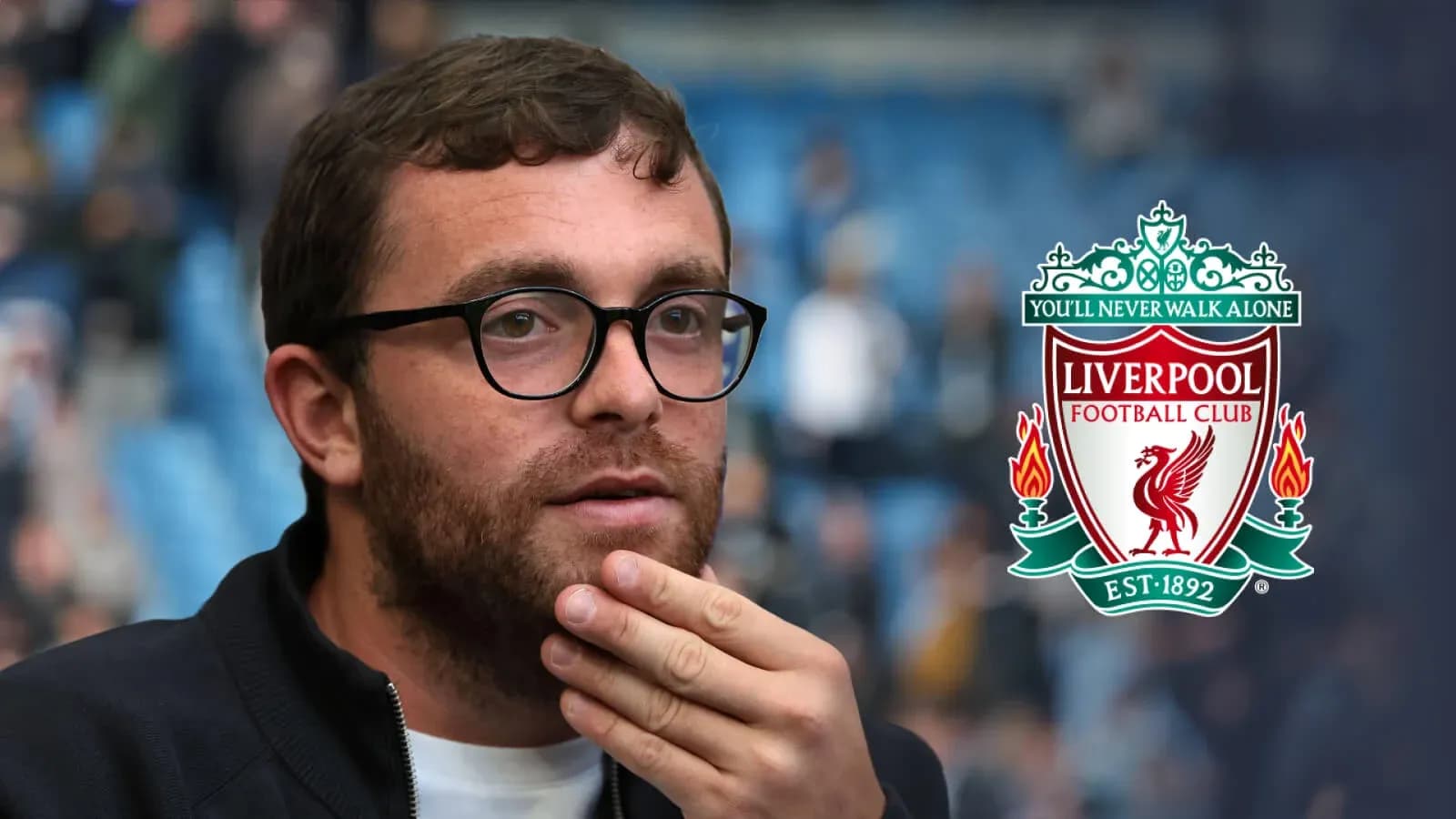 Person with glasses in front of Liverpool FC logo
