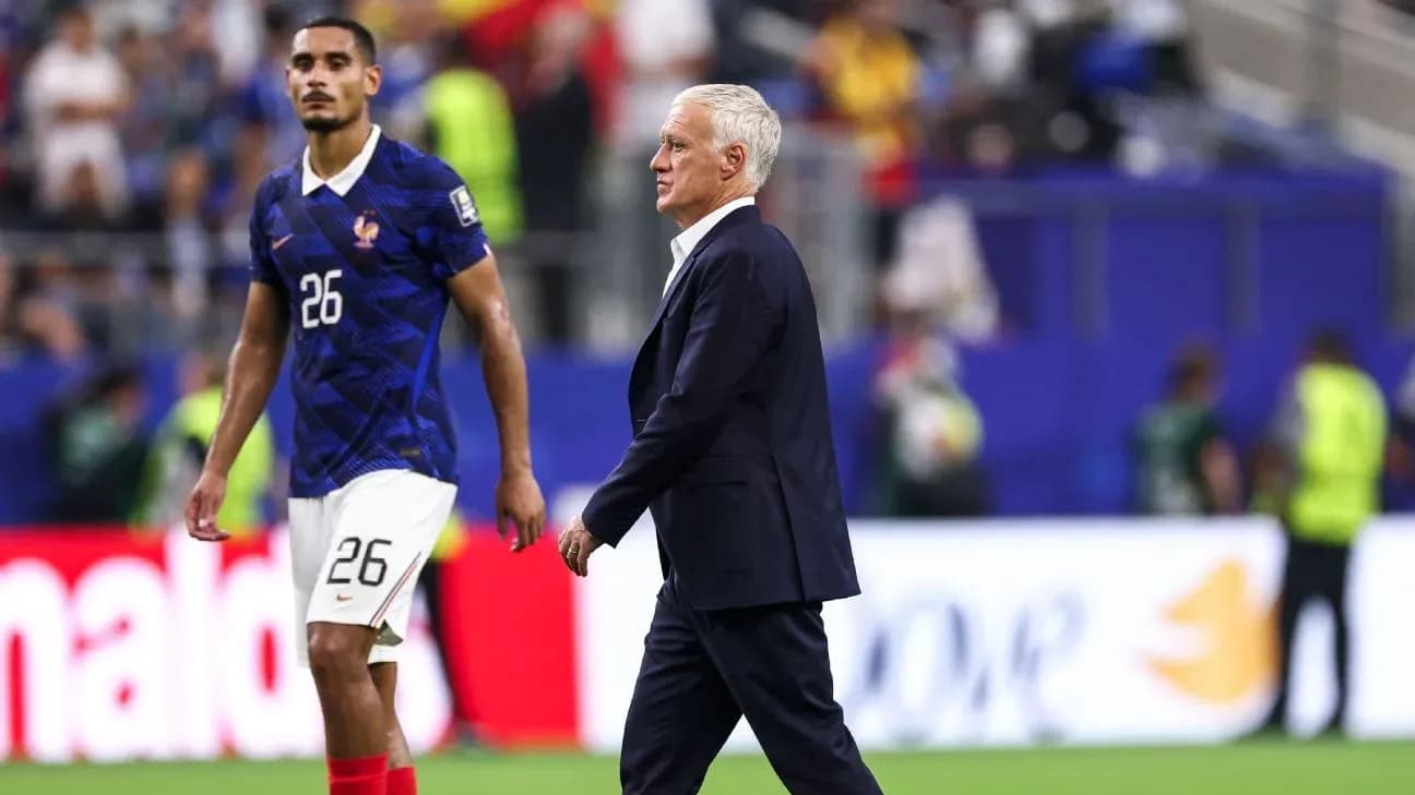 France coach walking past player on the pitch