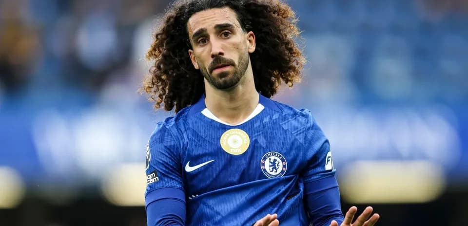 Player in blue Chelsea kit gesturing on the field