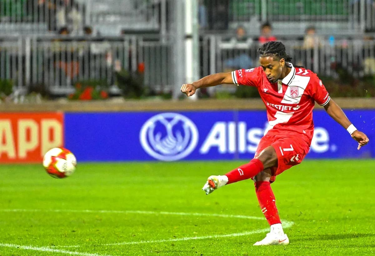 Cavalry FC player taking a shot on goal Cavalry FC player taking a shot on goal