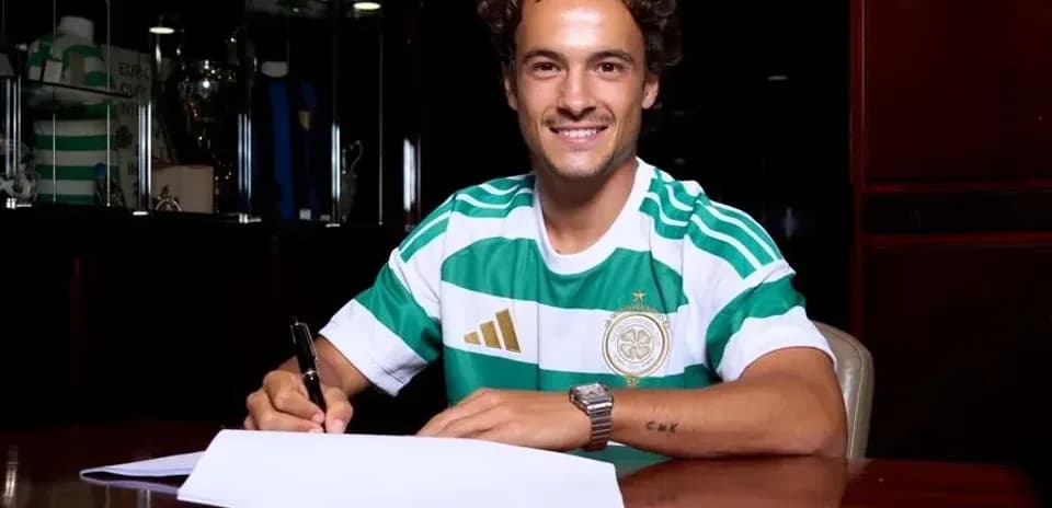 Player signing contract while wearing club jersey