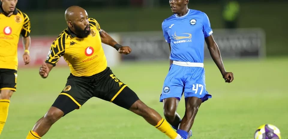 Player dribbling past opponent during a soccer match