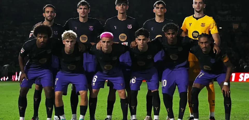 Football team posing for photo before match