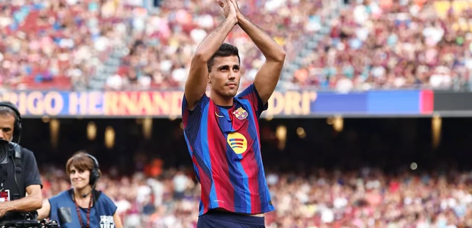 Player applauding fans at Barcelona stadium