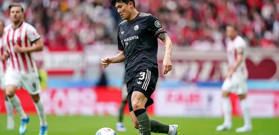 Player dribbling the ball during a football match