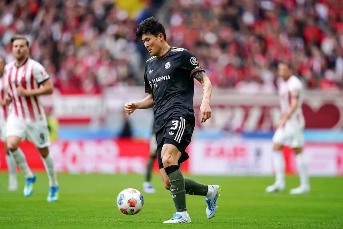 Player dribbling the ball during a football match