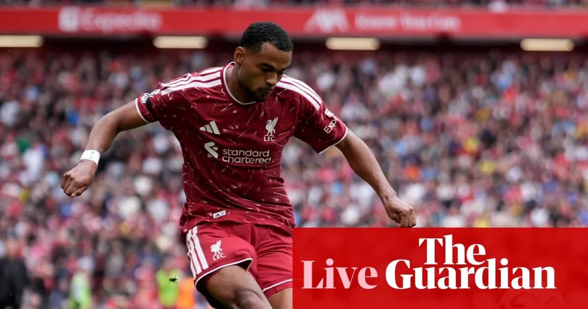 Liverpool player dribbling the ball during match