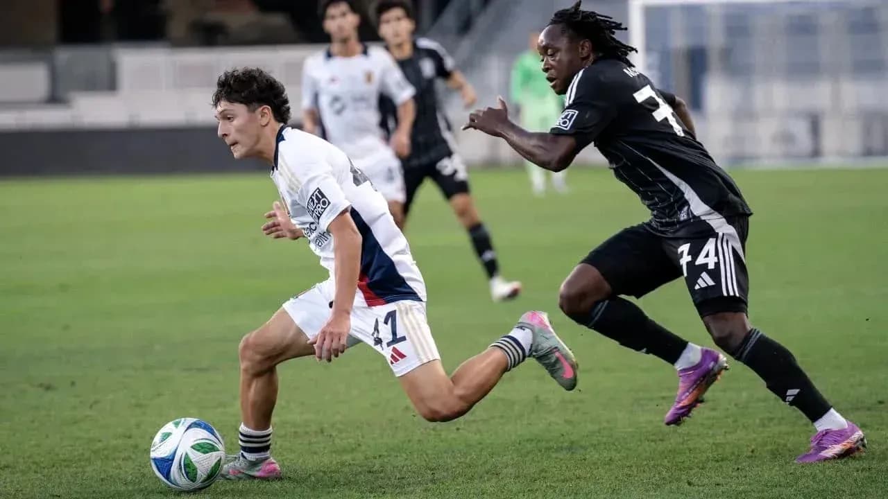 Player dribbling the ball during match action