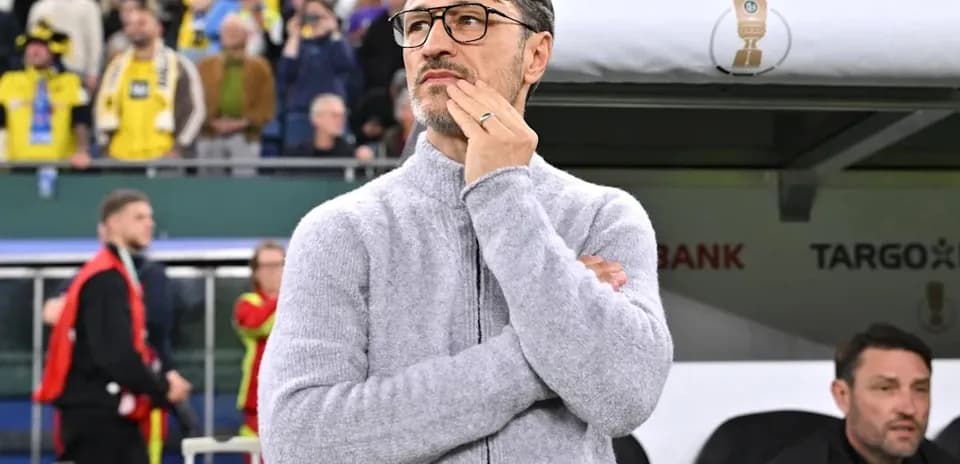 Coach observing the game from the sideline