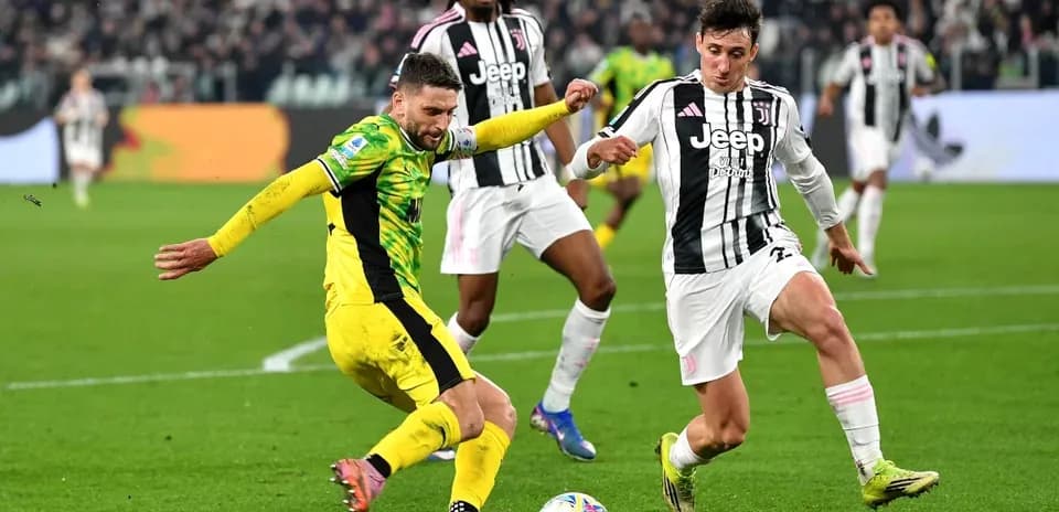 Players competing for the ball during football match