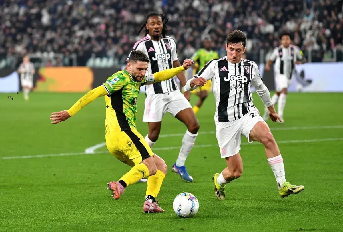Players competing for the ball during football match