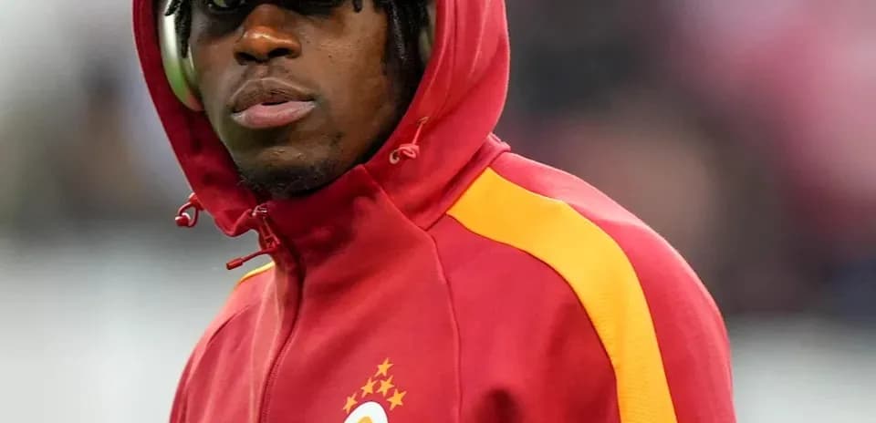 Player in Galatasaray hoodie during warm-up