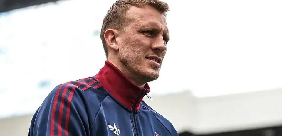 Player in training gear at stadium entrance