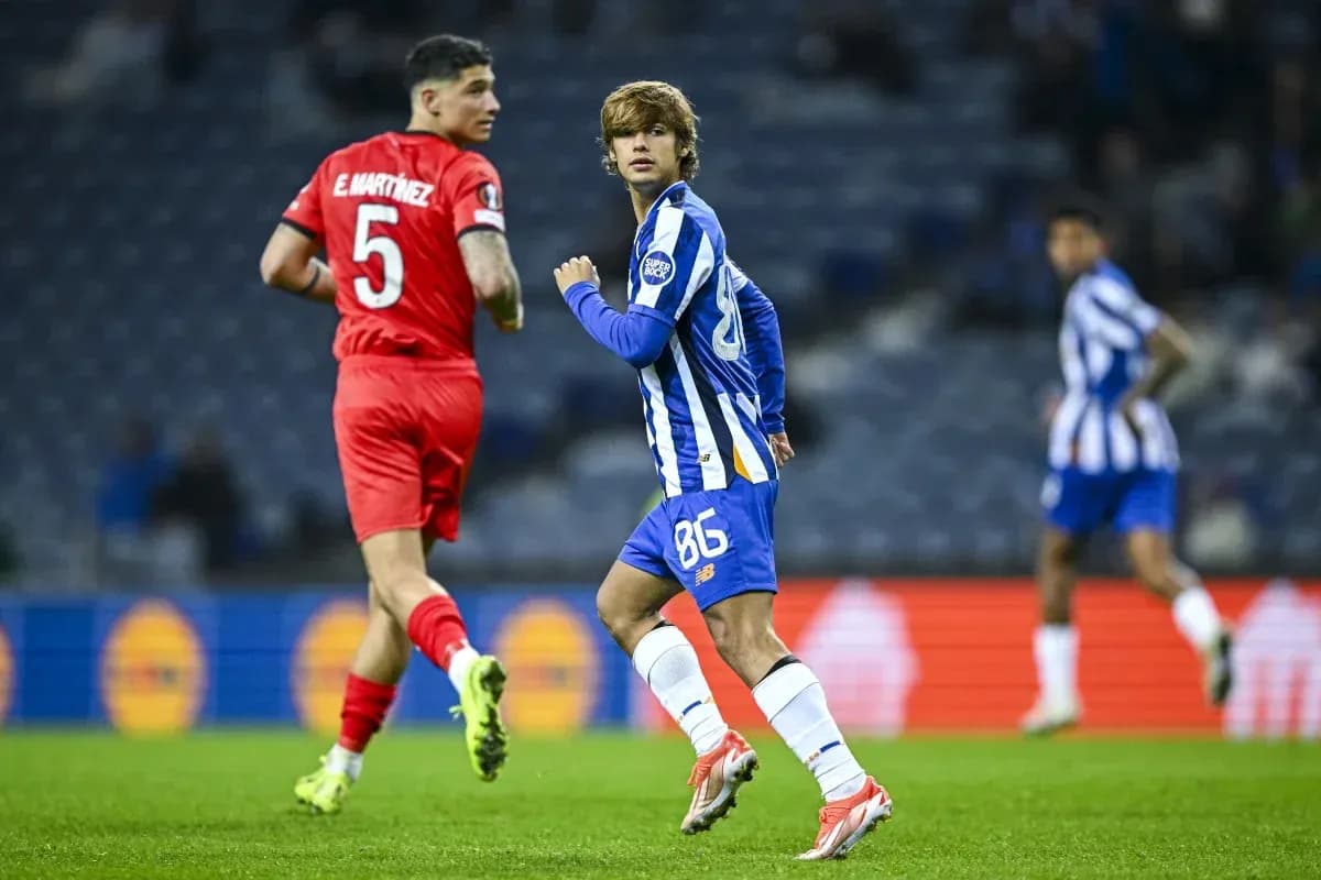 Player in blue jersey running on the pitch