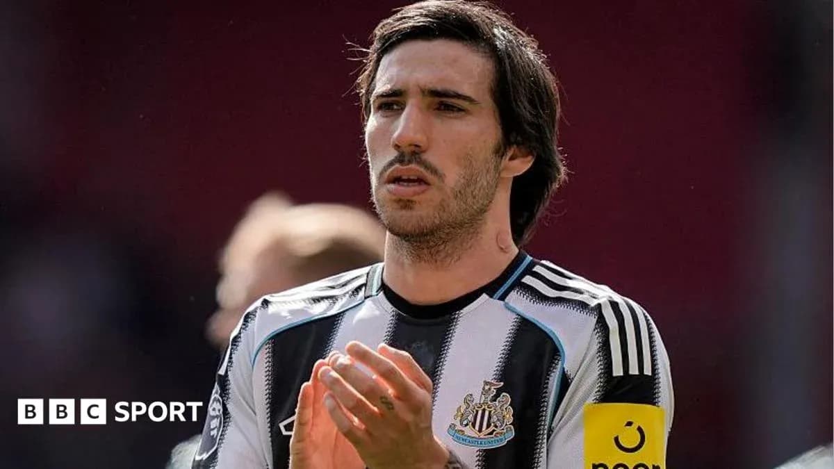 Player applauding in Newcastle United jersey