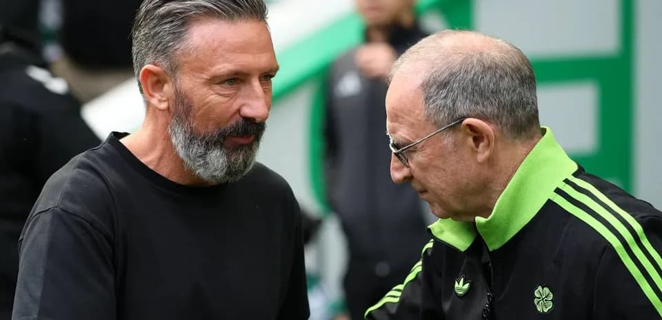 Two coaches discussing before a match