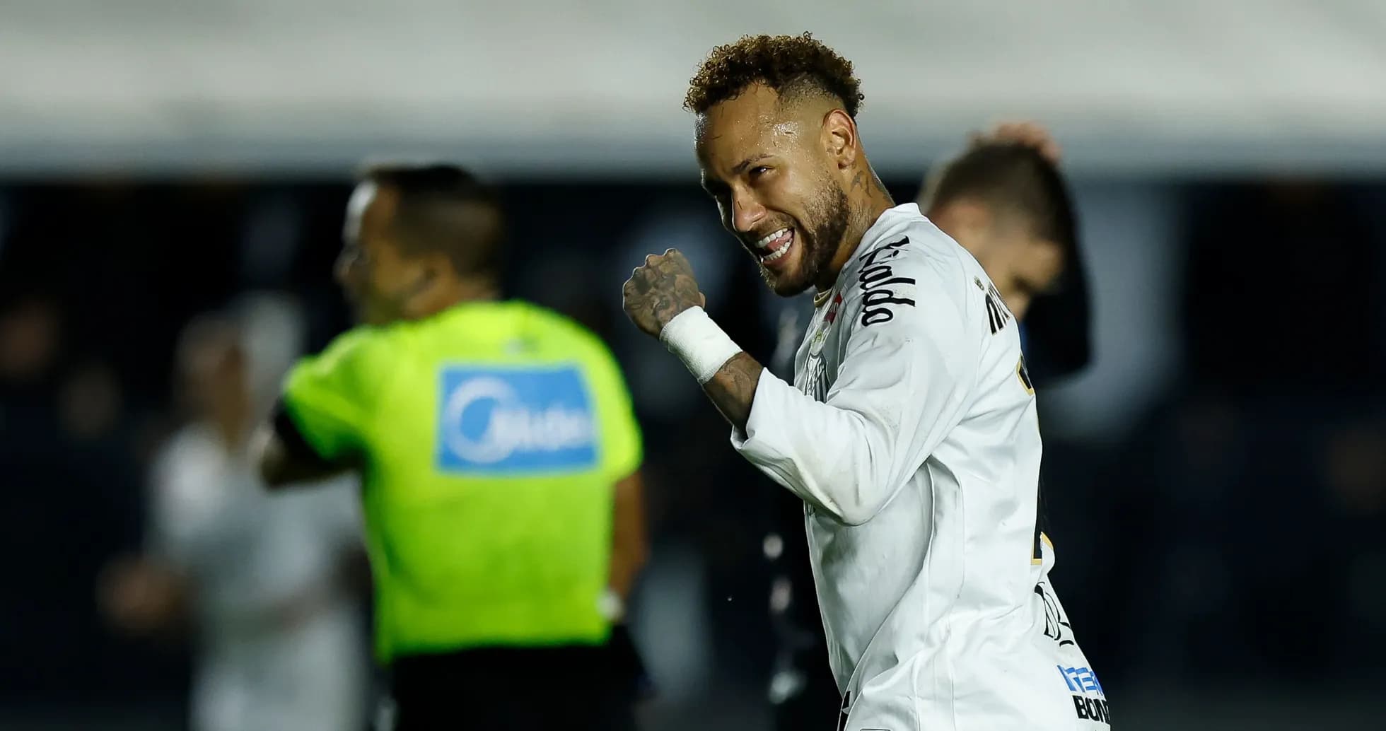 Neymar celebrating after a match in Santos jersey