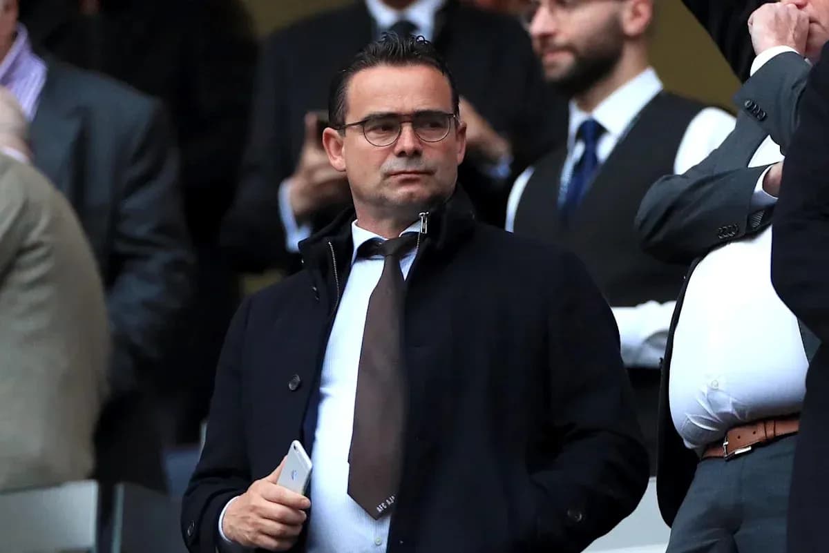 Man in suit observing from VIP section