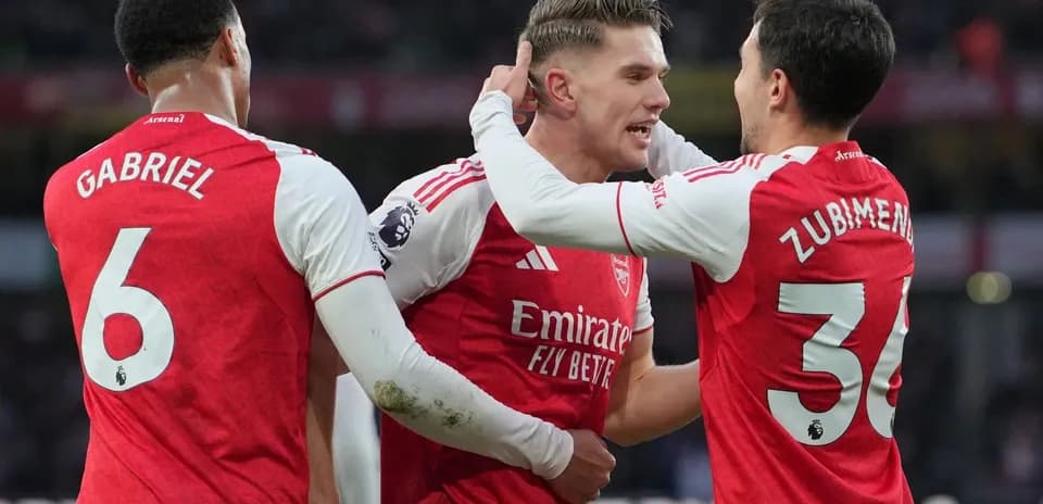 Arsenal players celebrating during Premier League match