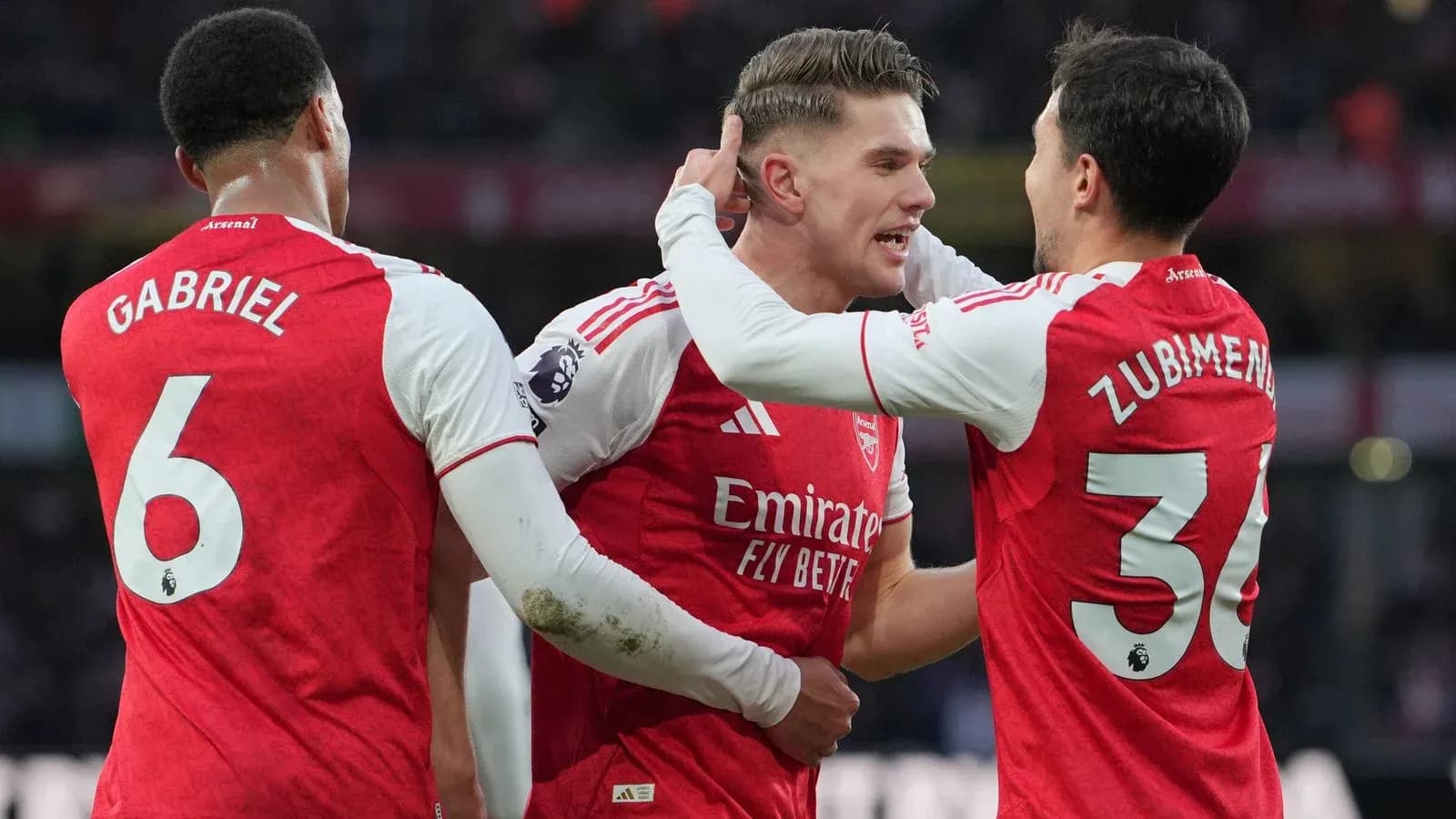 Arsenal players celebrating during Premier League match