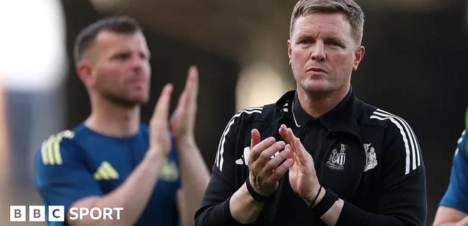 Coach applauding with players in background