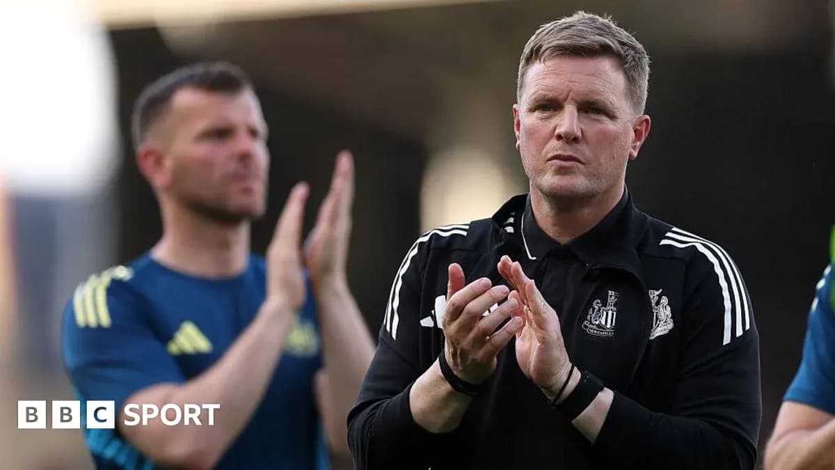 Coach applauding with players in background