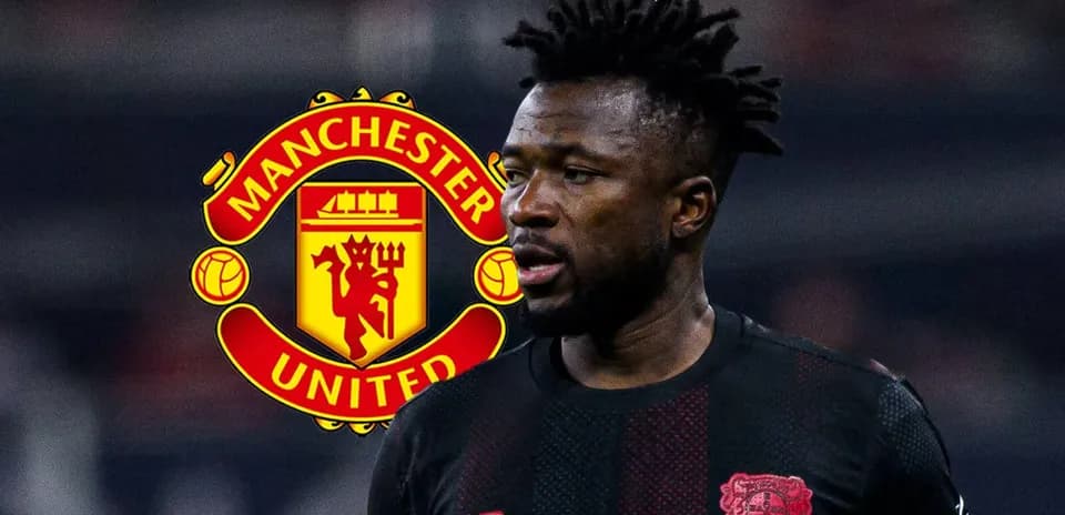Player in black jersey with Manchester United logo behind