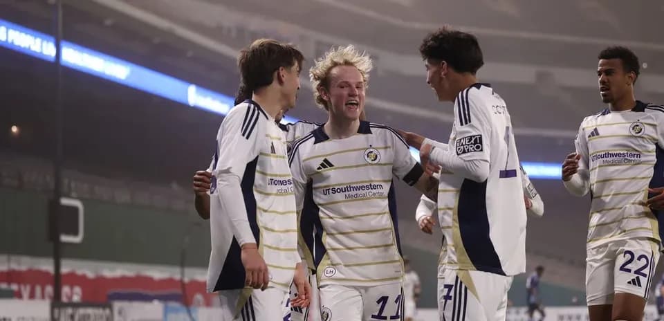 Players celebrating a goal during match