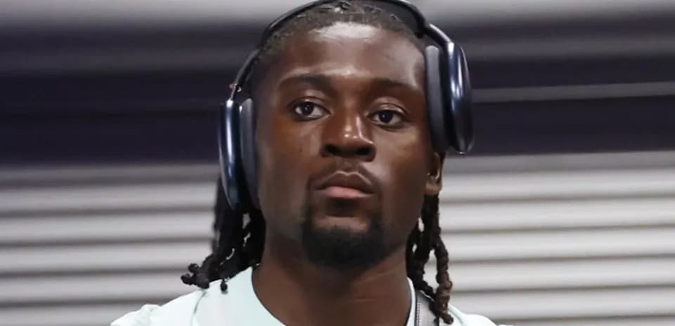 Athlete wearing headphones in a casual setting