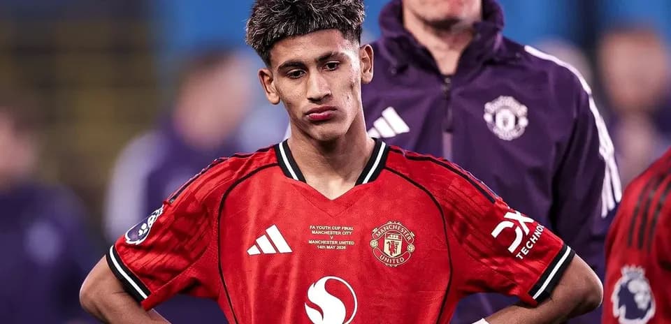 Player in Manchester United kit looking down