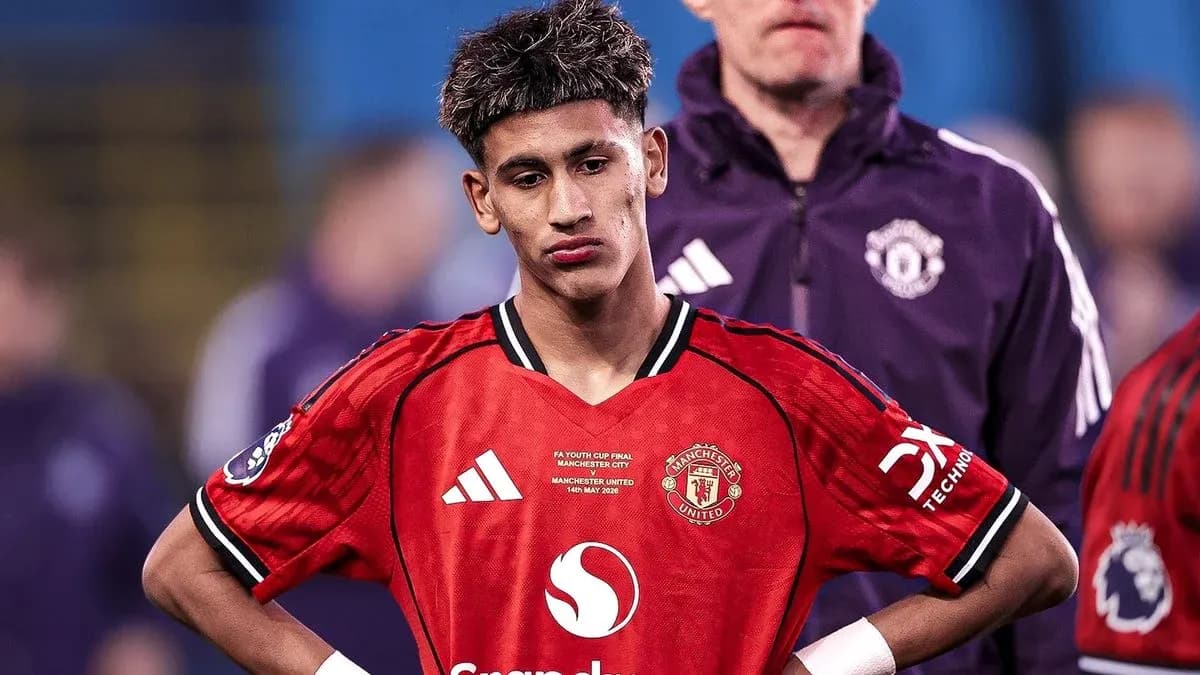Player in Manchester United kit looking down