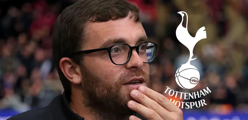 Man with glasses watching a football match
