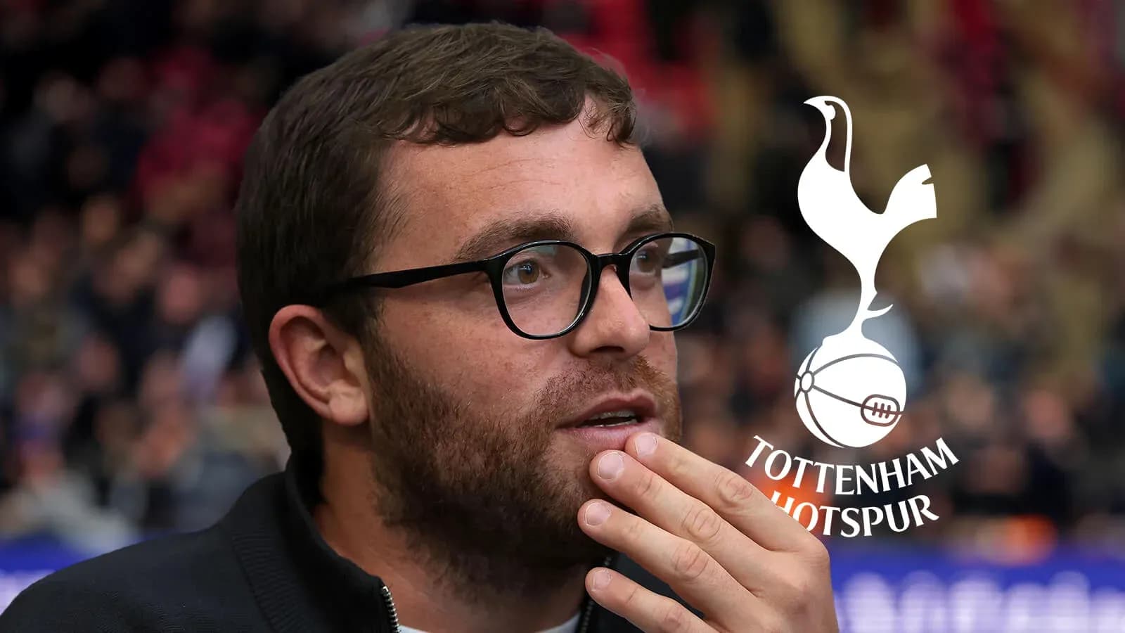 Man with glasses watching a football match