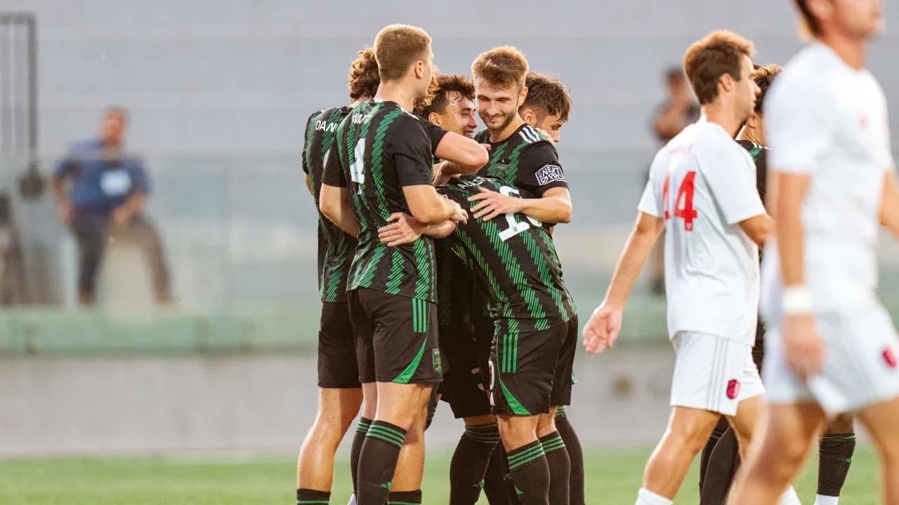 Players celebrating a goal during match