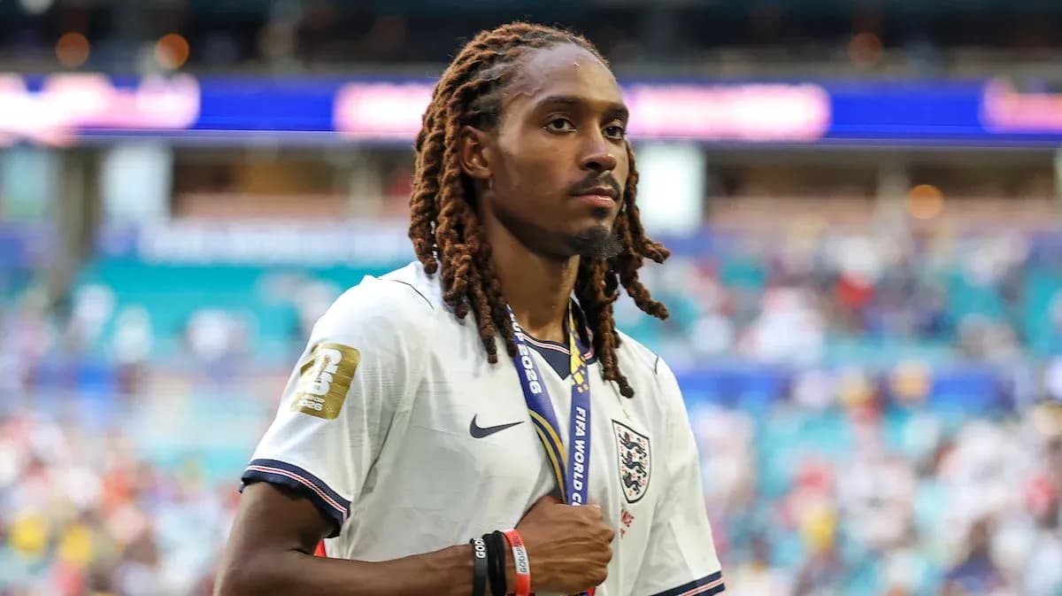 Player wearing England jersey walking on field