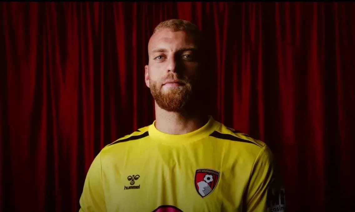 Goalkeeper wearing yellow jersey with AFC Bournemouth crest