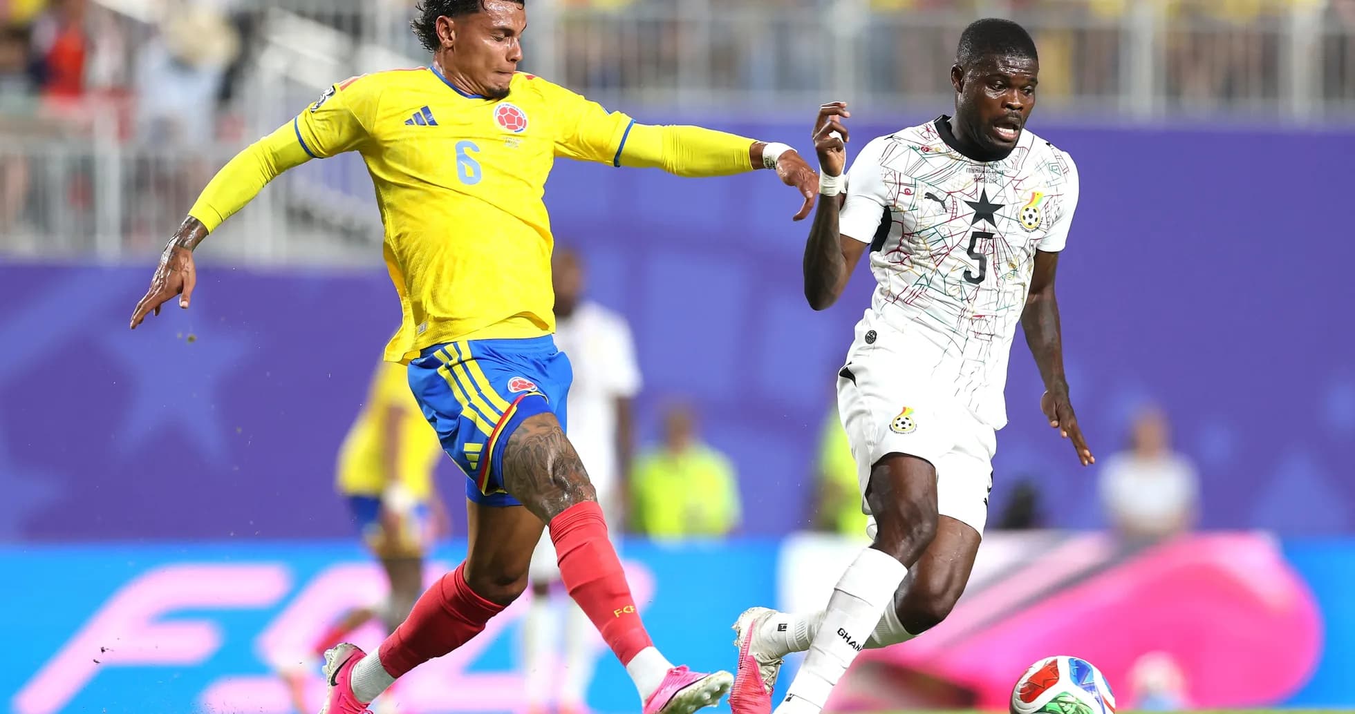 Colombian player challenges Ghanaian opponent during match