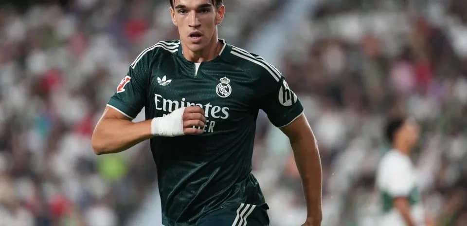 Player running on the field in green kit