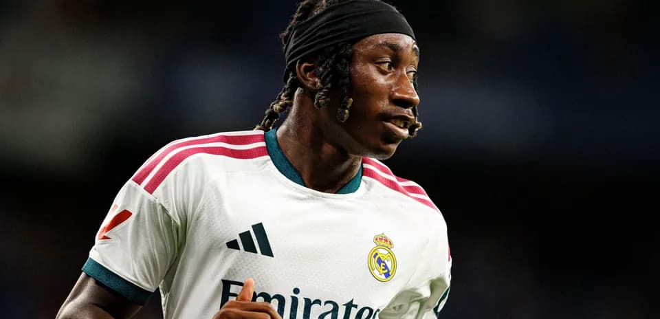 Player in Real Madrid jersey during match warm-up