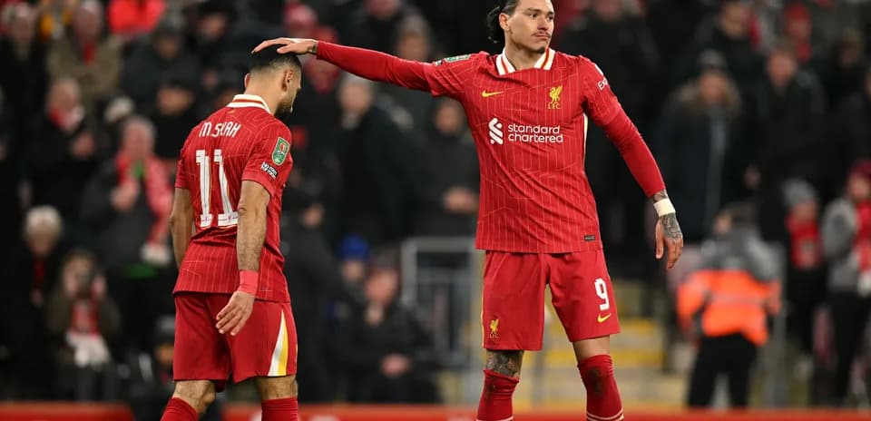 Liverpool players interacting during a match