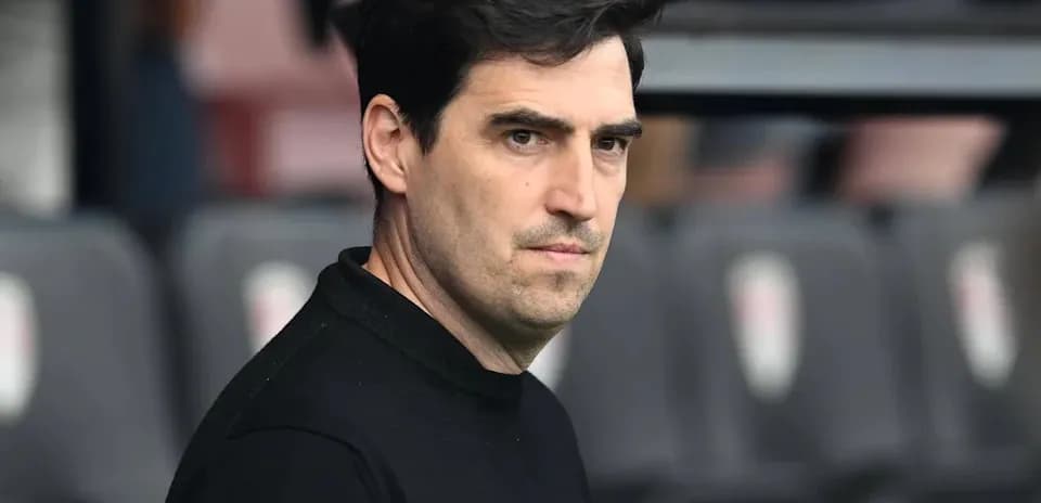 Coach observing match from the sidelines