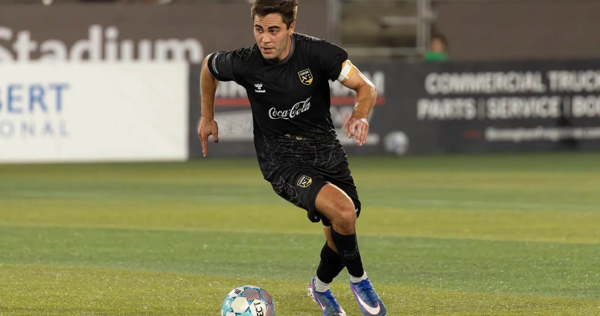 Player running with ball during match