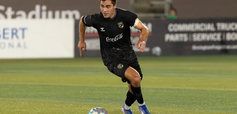 Player running with ball during match