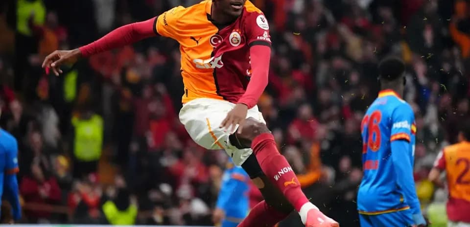 Player celebrating goal in Galatasaray jersey